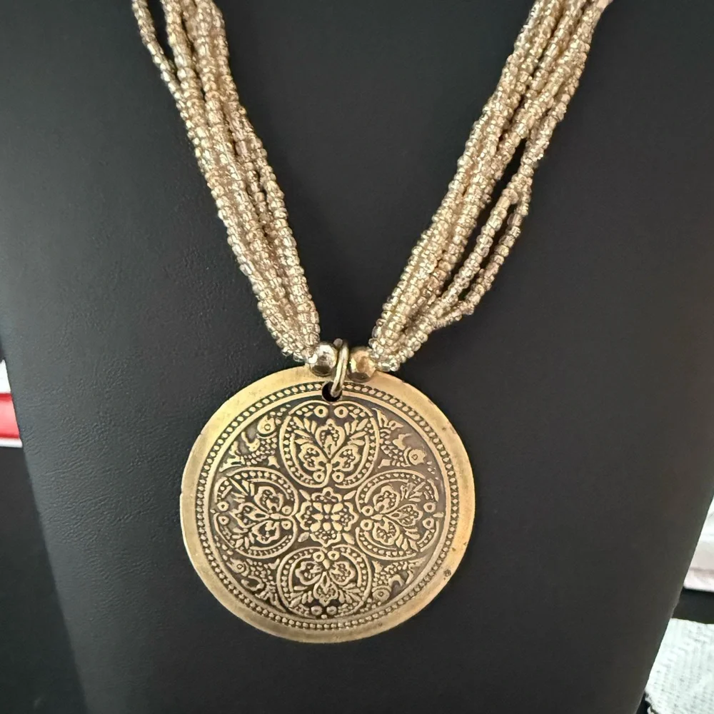 Tribal vintage gold tone 7 strand 16” beaded necklace with round pendant. - Picture 4 of 6